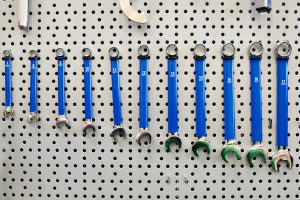 Tool kit for bicycle repair on wall of workshop